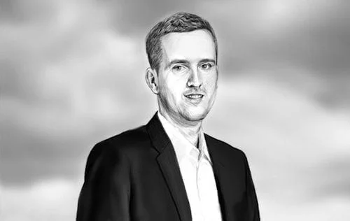 Grayscale sketch portrait of a smiling man in a dark suit jacket and white shirt against cloudy sky.