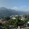 Panoramic image: City, mountains and forest