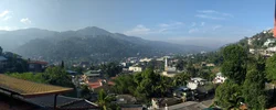 Panoramic image: City, mountains and forest